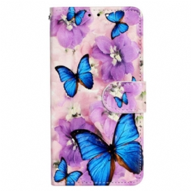 Custodia in pelle iPhone 15 Plus Piccole Farfalle Blu Con Cinturino