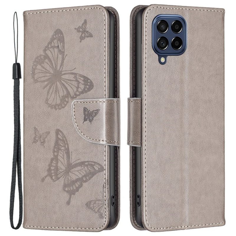 Custodia in pelle Samsung Galaxy M53 5G Farfalle Stampate Strappy