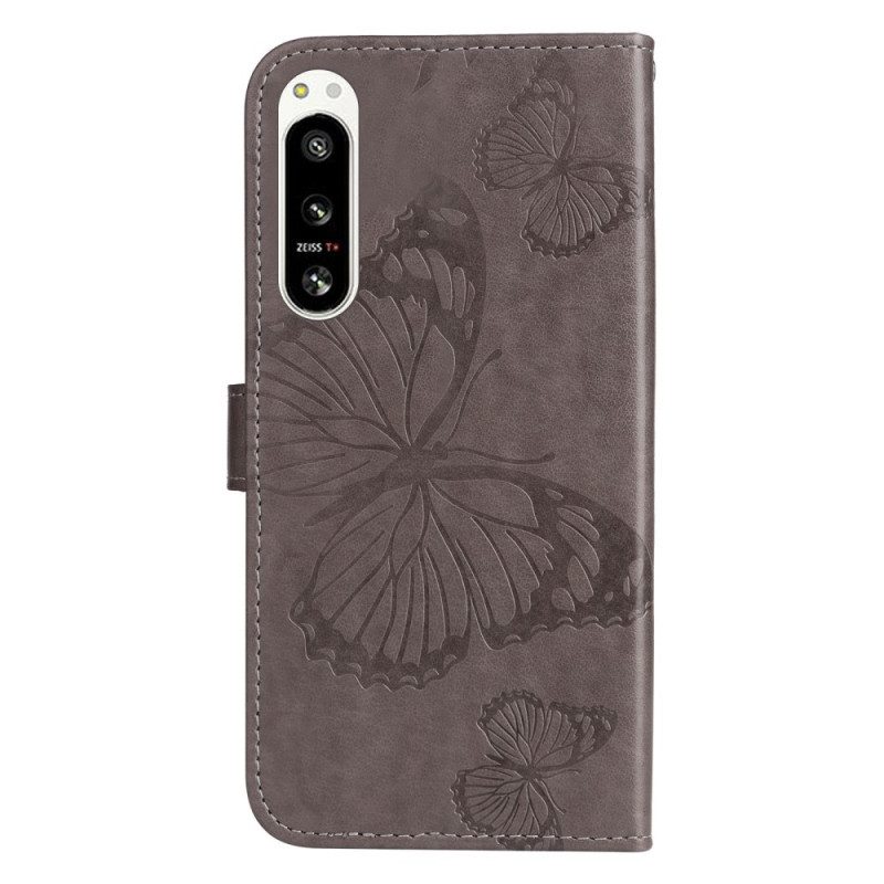 Custodia in pelle Sony Xperia 5 IV Farfalle Con Cinturino Gigante